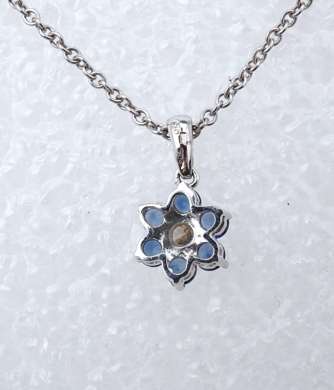 A sapphire and diamond pendant